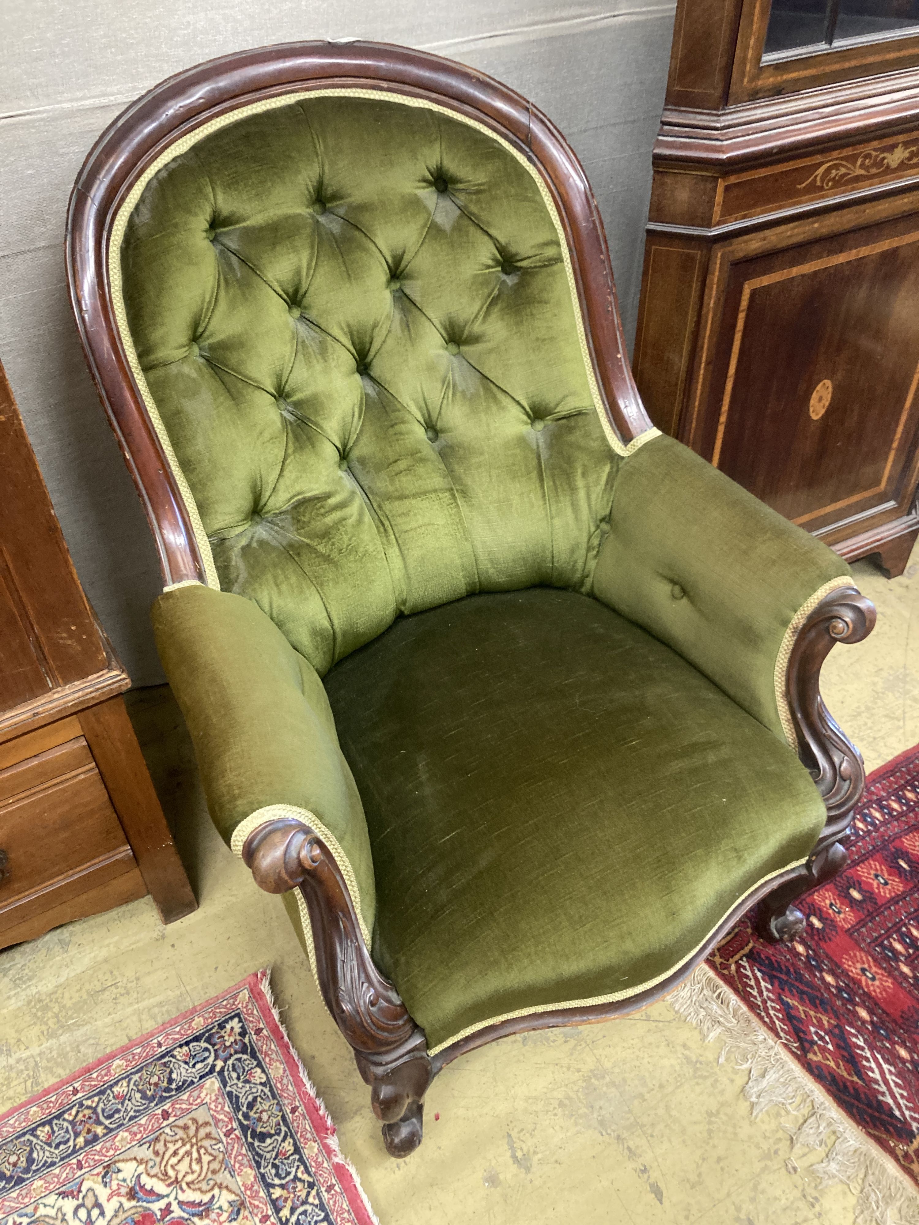 A Victorian mahogany spoonback armchair, width 88cm, depth 80cm, height 94cm